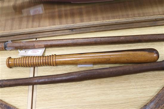 A tribal club, a boomerang and a truncheon, club length 63cm